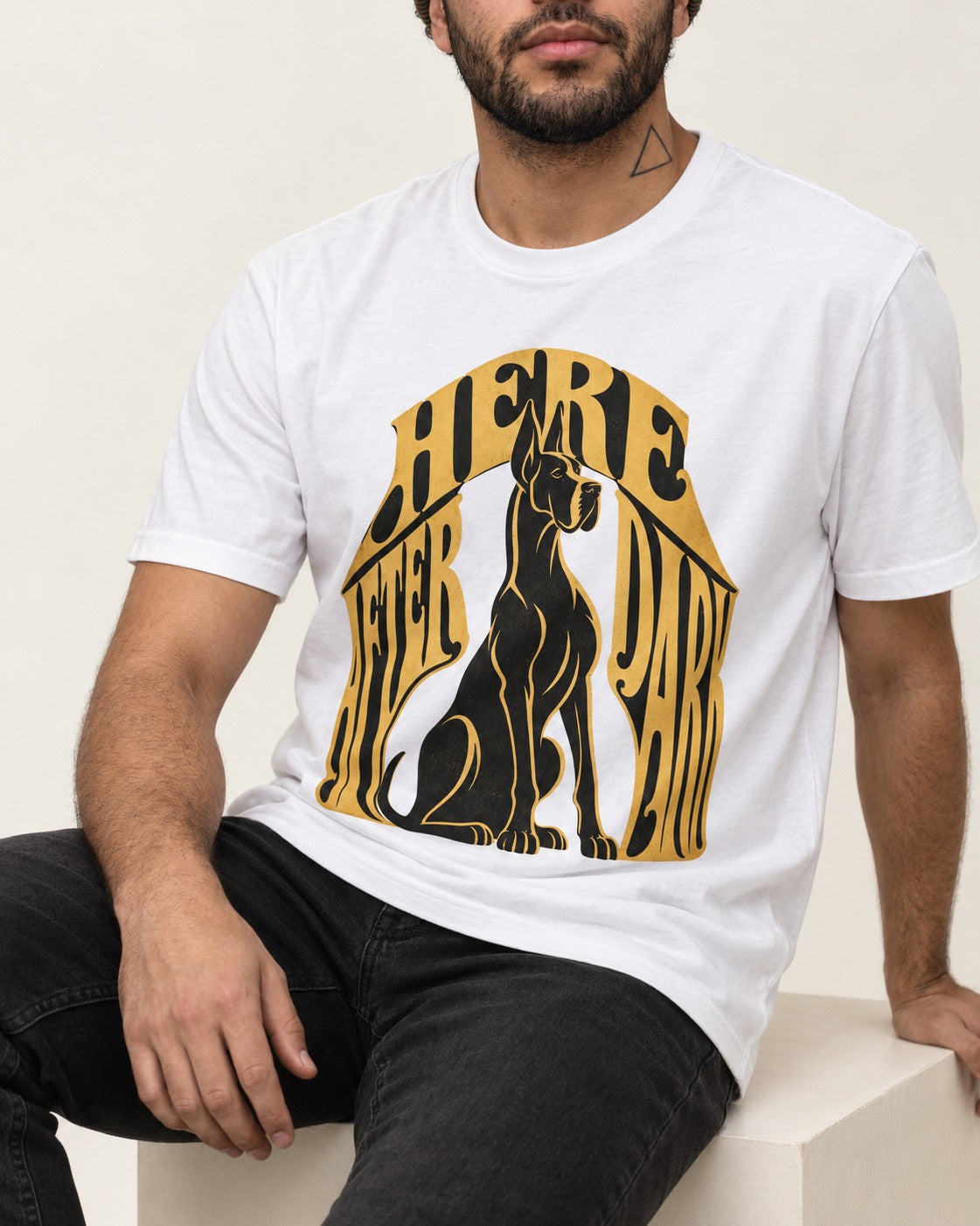 Great Dane Here After Dark T-Shirt in White, worn by a seated model