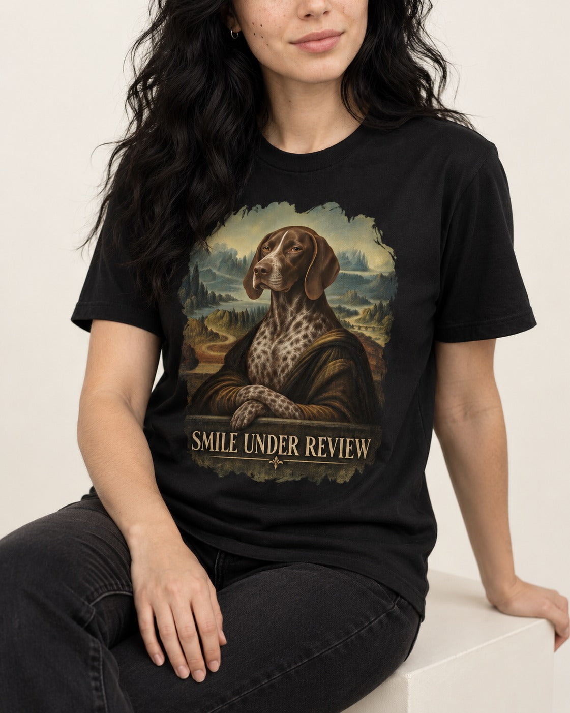 German Shorthaired Pointer Smile Under Review Renaissance Portrait Graphic T-Shirt in Black, worn by a seated model