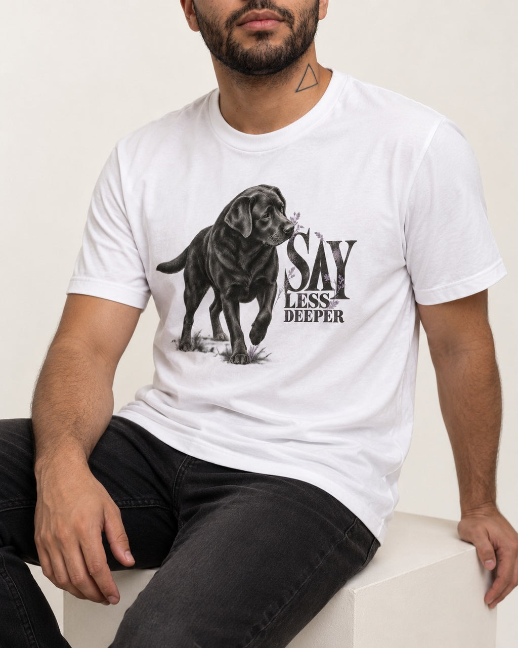 Say Less Deeper Labrador Retriever T-Shirt in White, worn by a seated model