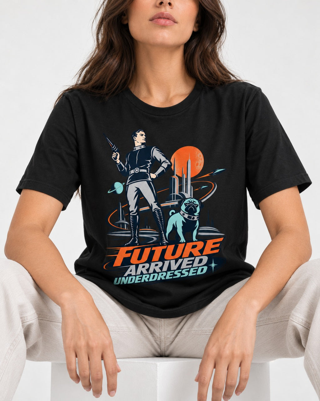 Pug Future Arrived Underdressed Space Hero Graphic T-Shirt in Black, worn by a seated model