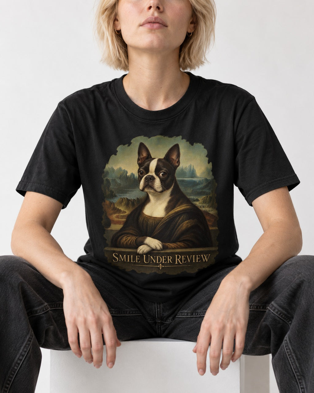 Smile Under Review Boston Terrier Mona Lisa Portrait T-Shirt in Black, worn by a seated model