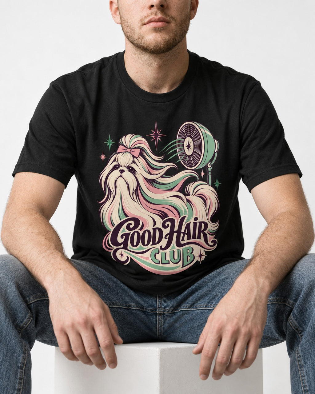 Shih Tzu Good Hair Club Salon Fan Graphic T-Shirt in Black, worn by a seated model