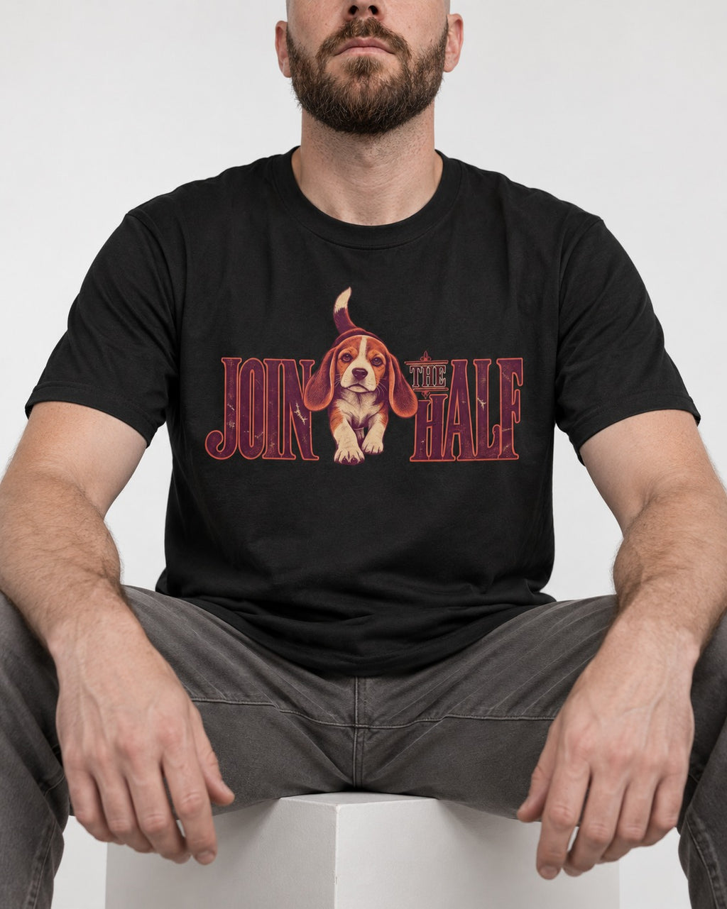 Beagle Join The Half T-Shirt in Black, worn by a seated model