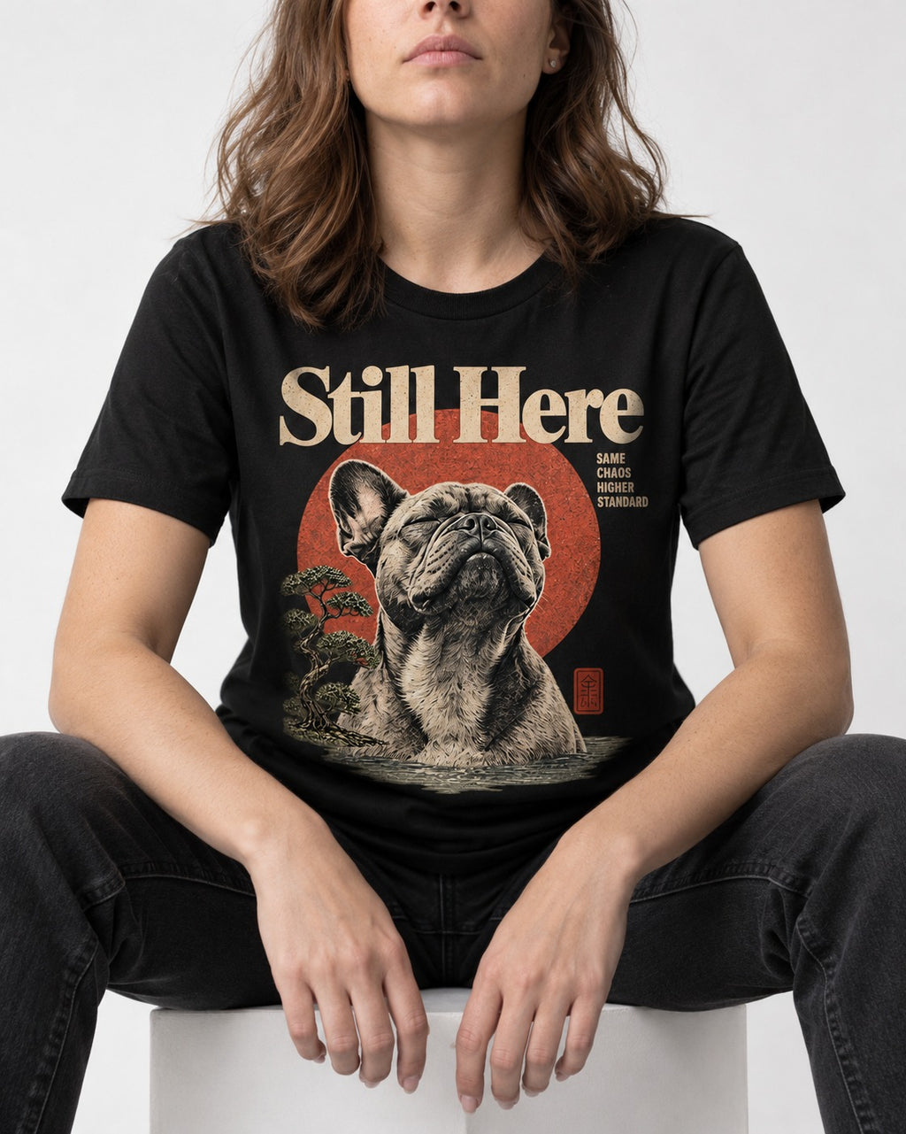 Frenchie Still Here Bonsai Portrait Graphic T-Shirt in Black, worn by a seated model