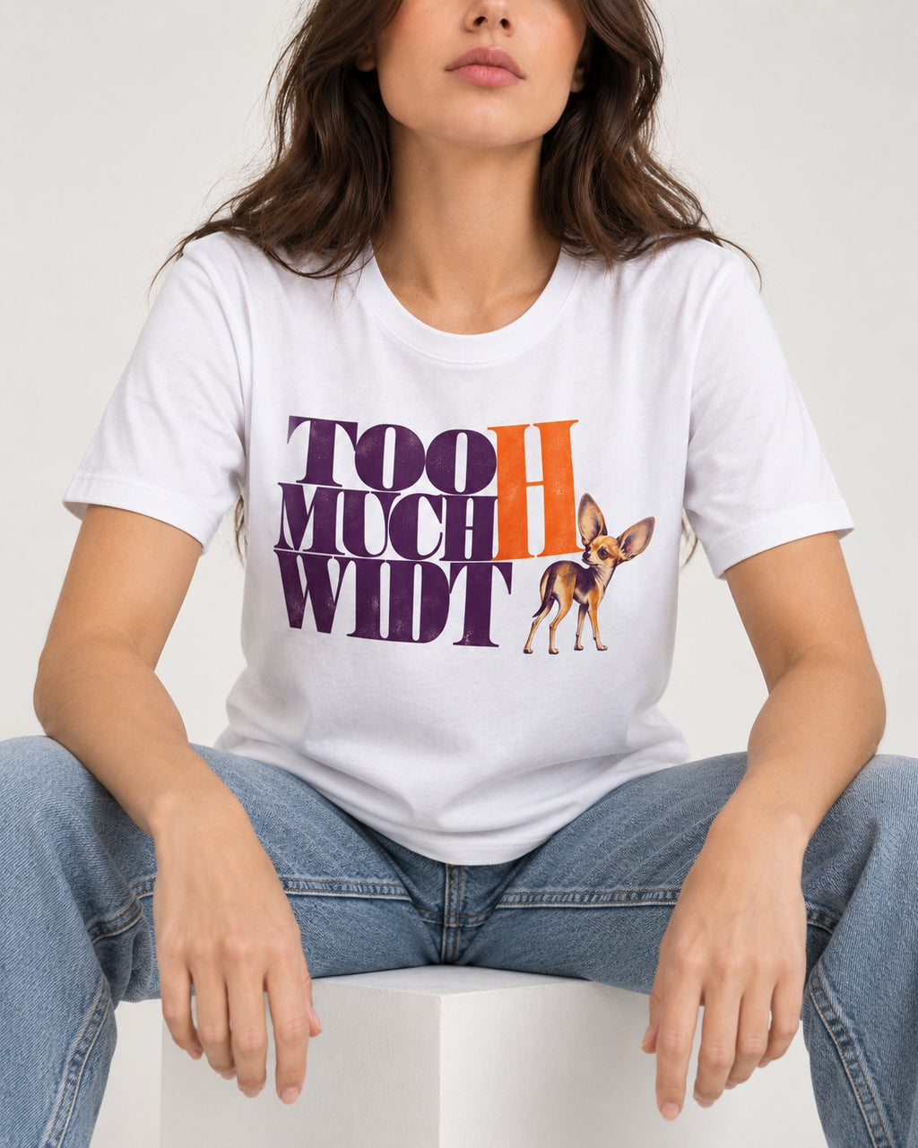 Too Much Width Chihuahua T-Shirt in White, worn by a seated model