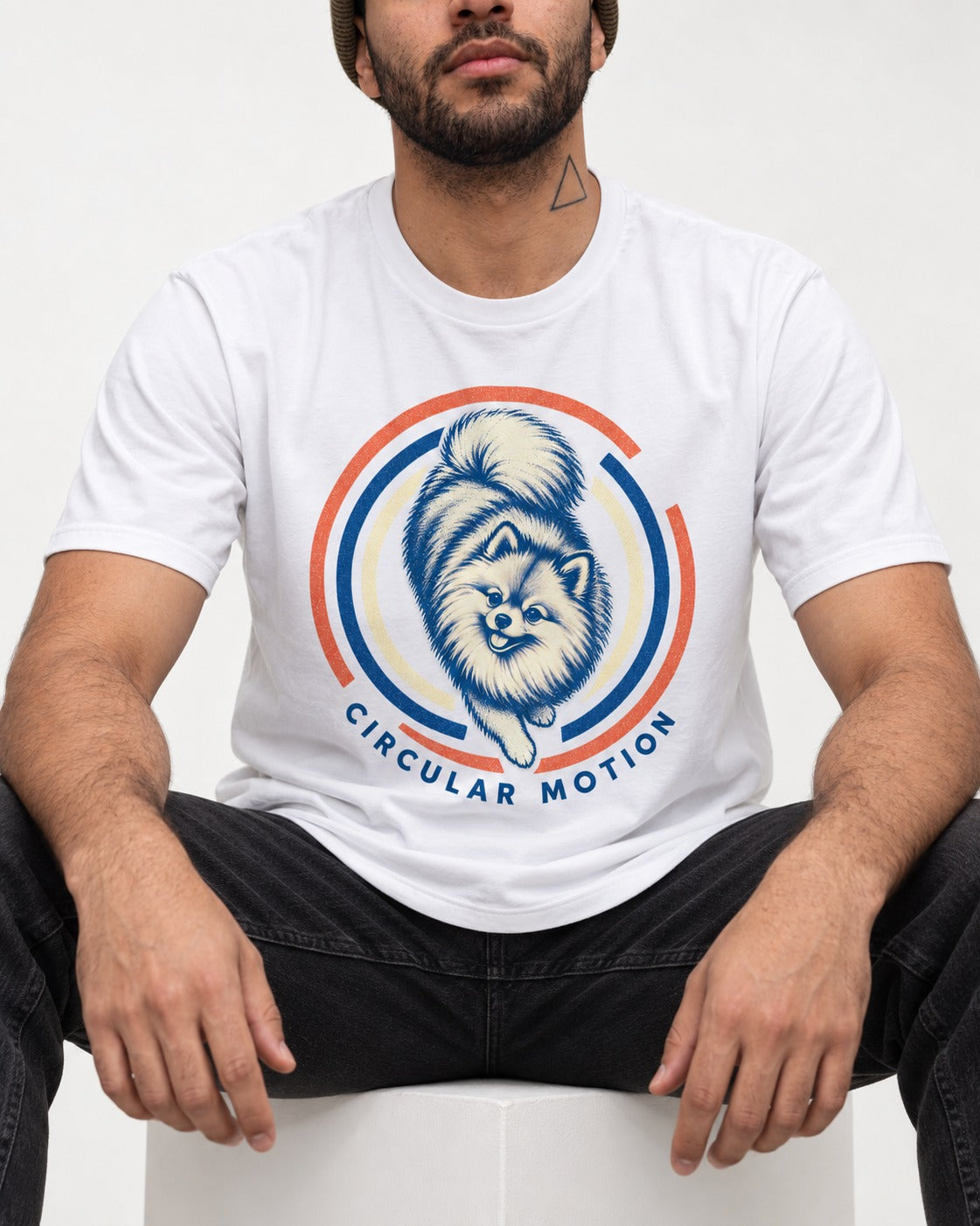 Pomeranian Circular Motion T-Shirt in White, worn by a seated model