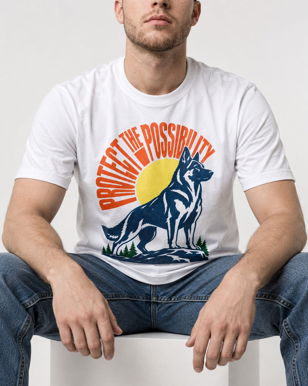 German Shepherd Dog Protect the Possibility T-Shirt in White, worn by a seated model
