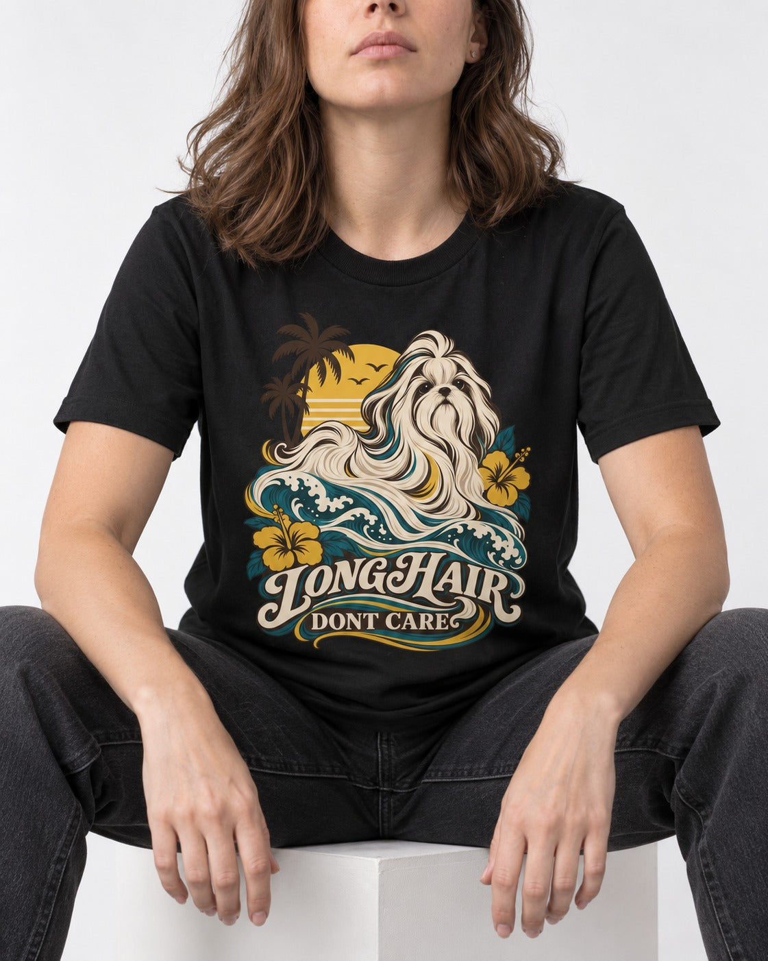 Shih Tzu Long Hair Don't Care Tropical Wave Graphic T-Shirt in Black, worn by a seated model