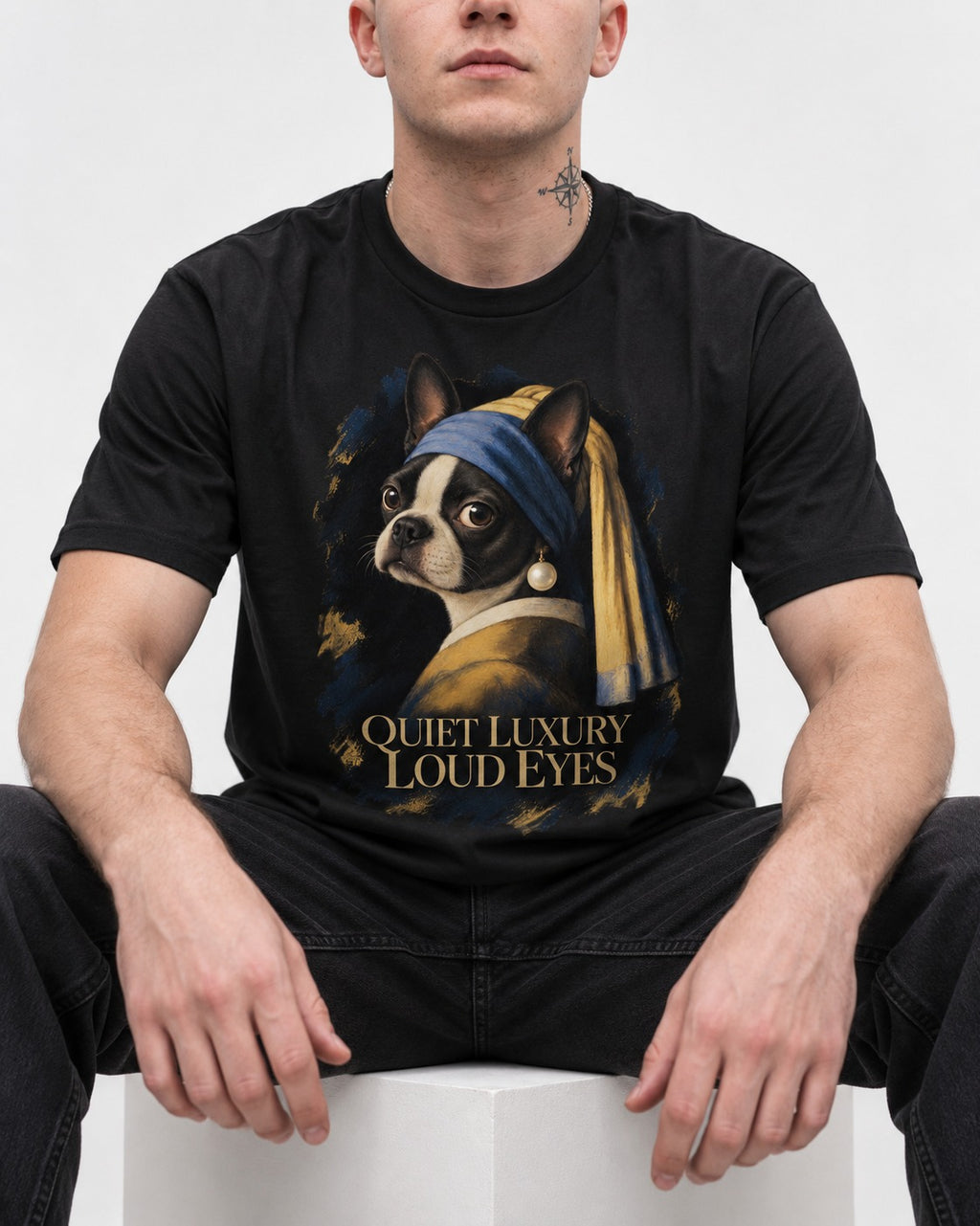 Quiet Luxury Loud Eyes Boston Terrier Pearl Portrait T-Shirt in Black, worn by a seated model