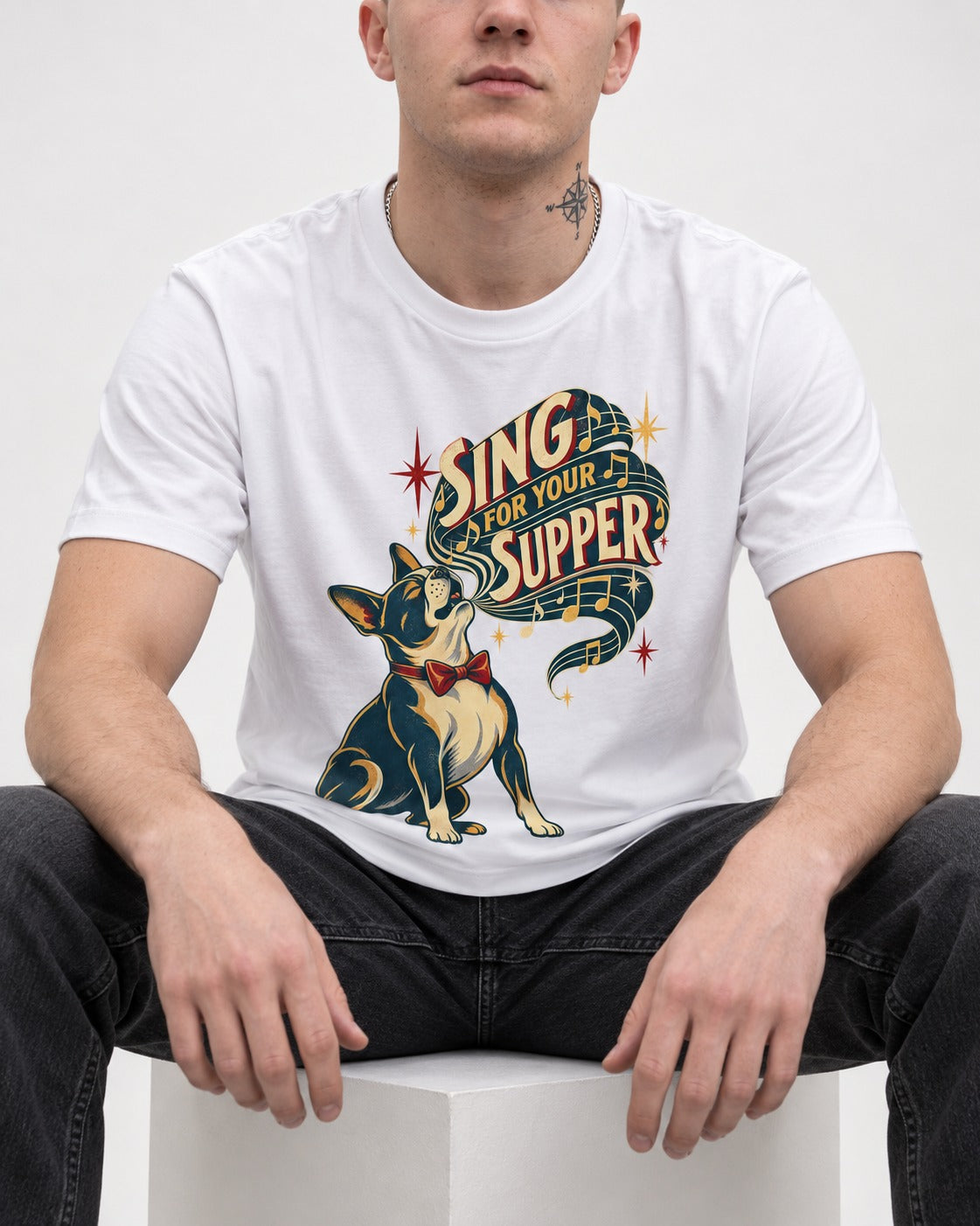 Boston Terrier Sing for Your Supper T-Shirt in White, worn by a seated model
