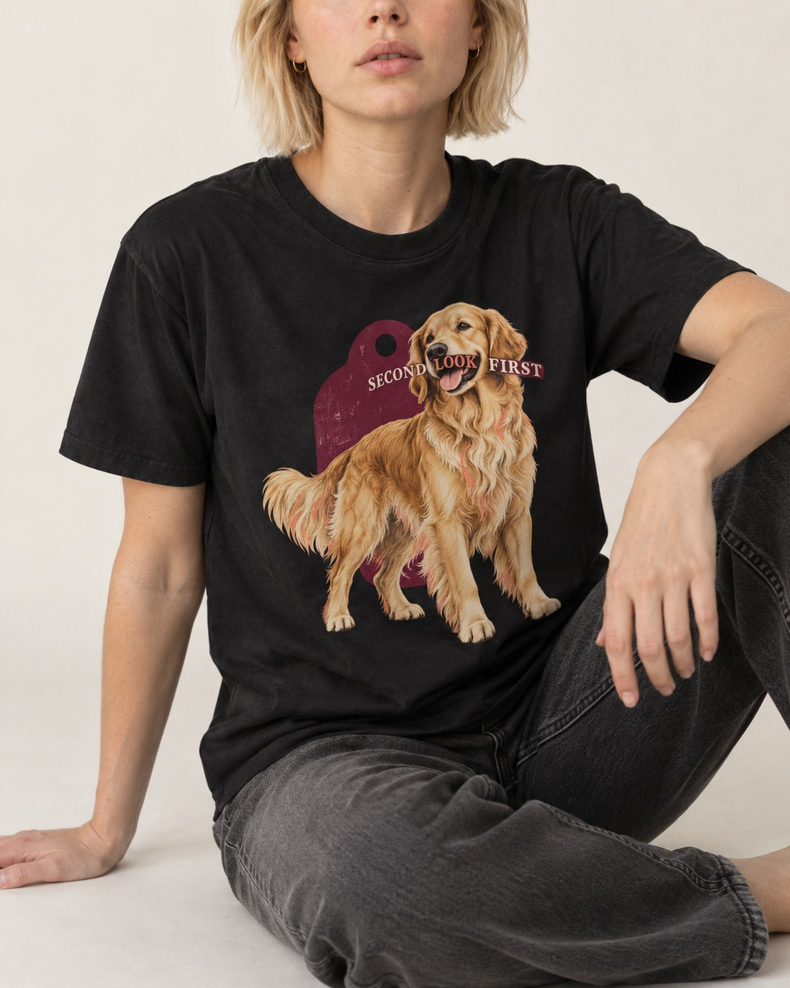 Golden Retriever Second Look First Tag Portrait Graphic T-Shirt in Black, worn by a seated model