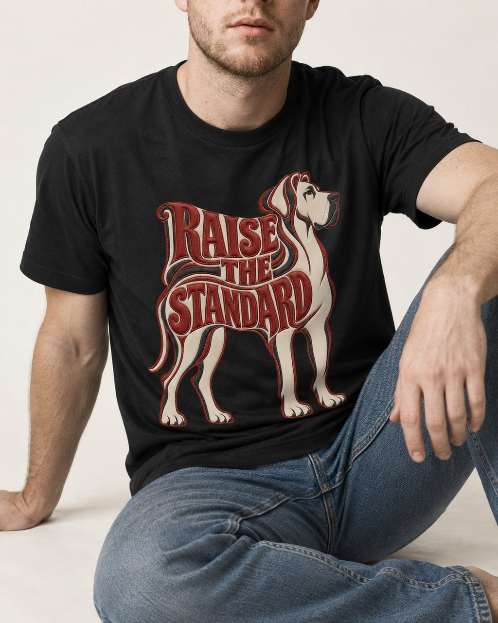 Great Dane Raise the Standard Typography Graphic T-Shirt in Black, worn by a seated model