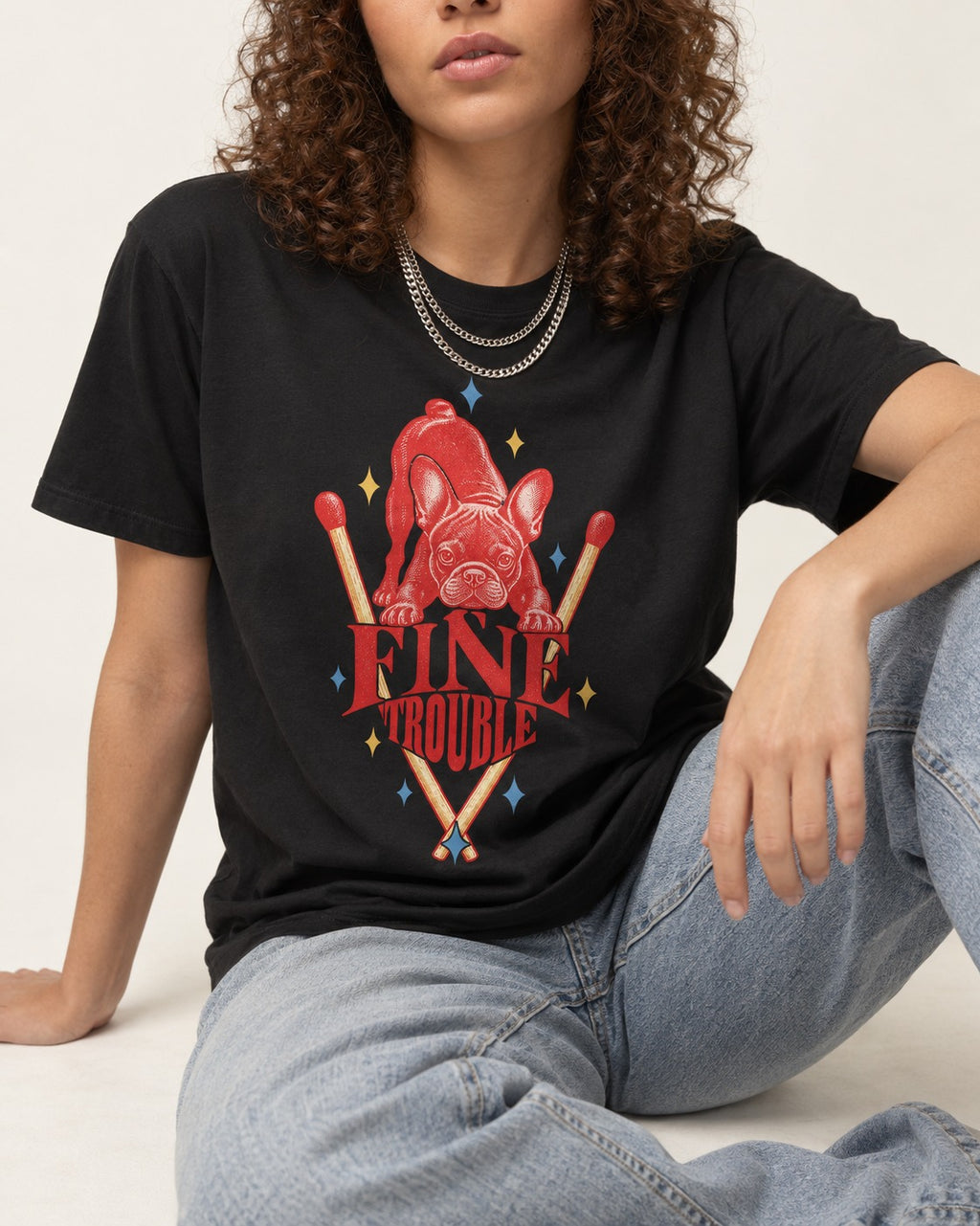Fine Trouble Boston Terrier Matchstick Graphic T-Shirt in Black, worn by a seated model