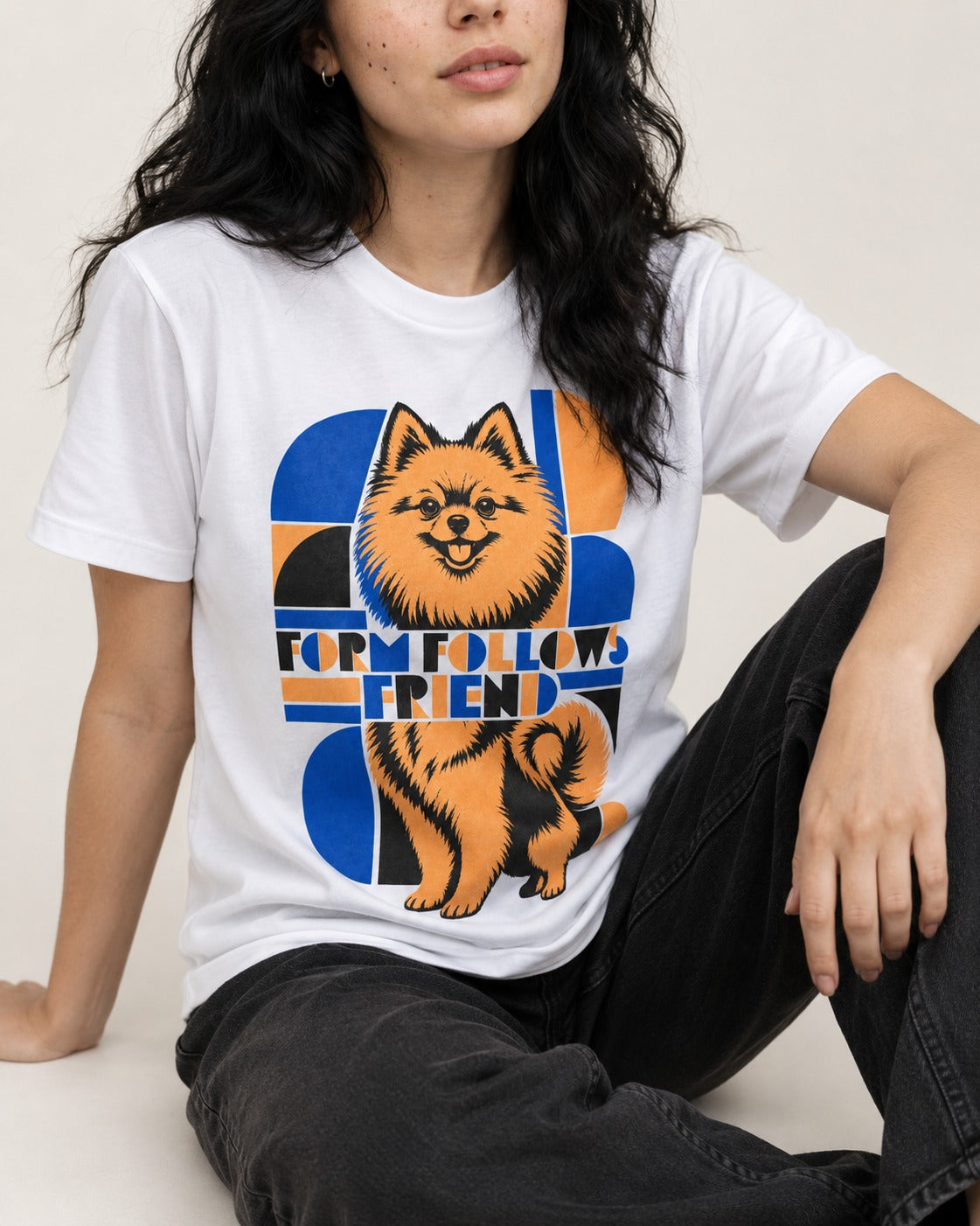 Form Follows Pomeranian Friend T-Shirt in White, worn by a seated model