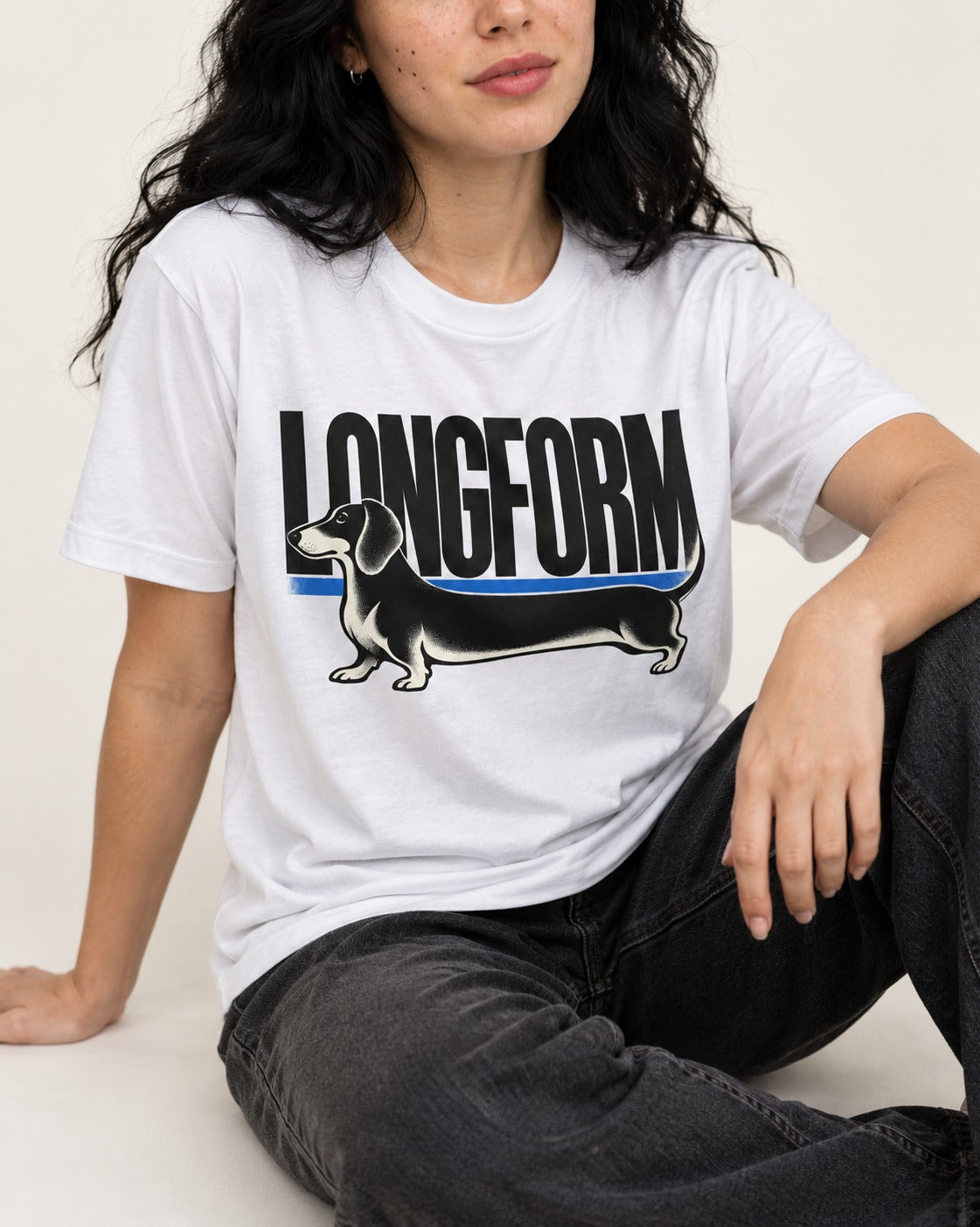 Longform Dachshund T-Shirt in White, worn by a seated model