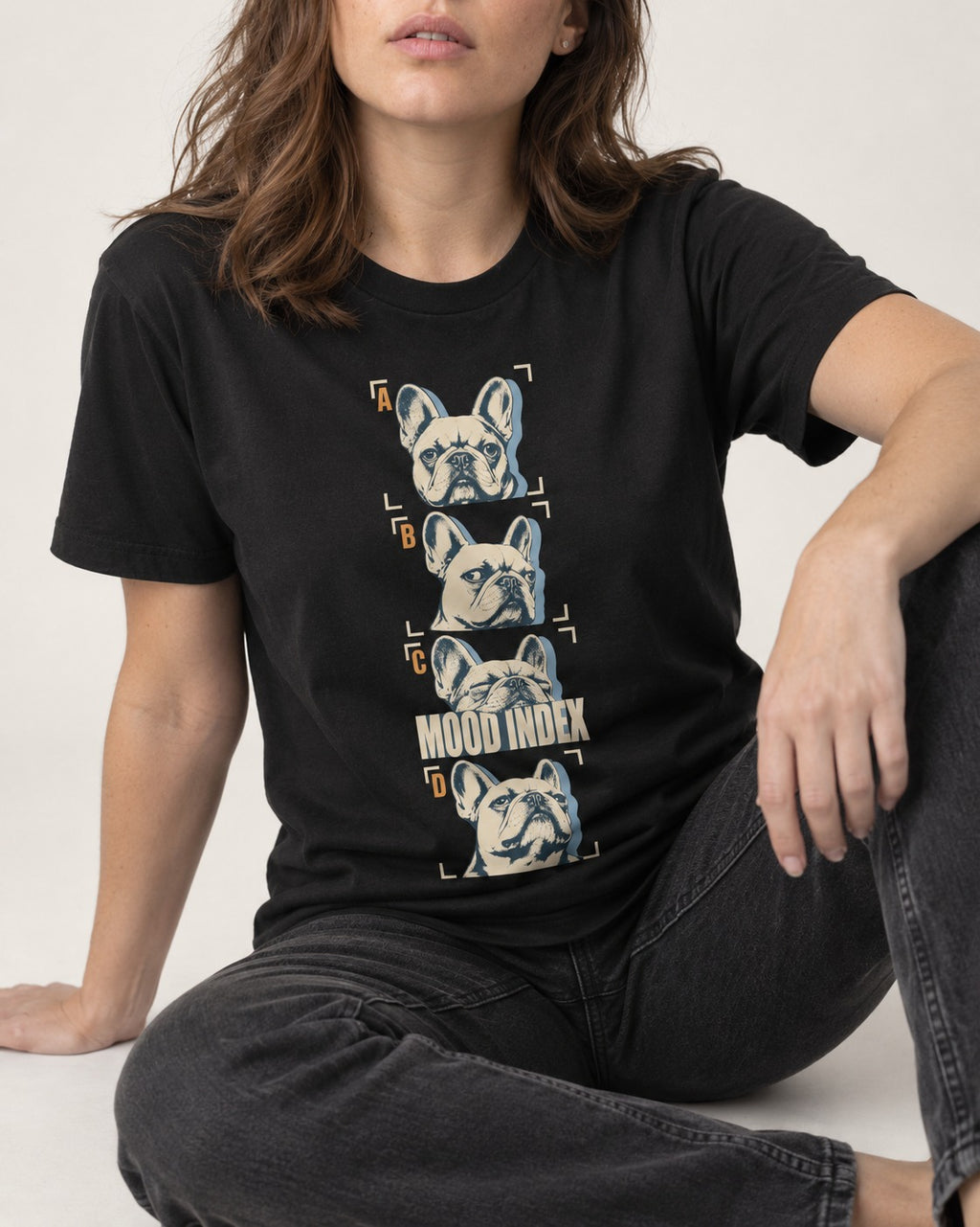 Frenchie Mood Index Four-Panel Strip Graphic T-Shirt in Black, worn by a seated model