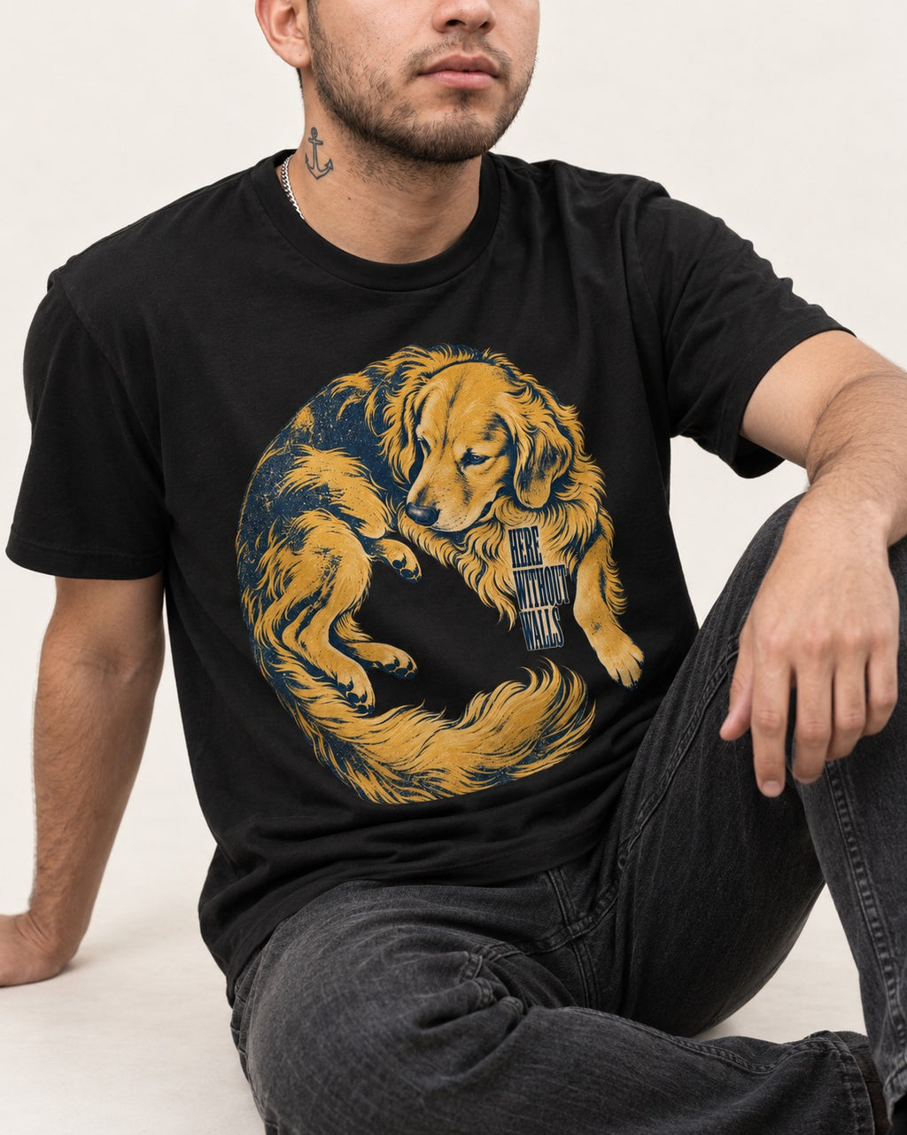 Golden Retriever Here Without Walls Curled Portrait Graphic T-Shirt in Black, worn by a seated model