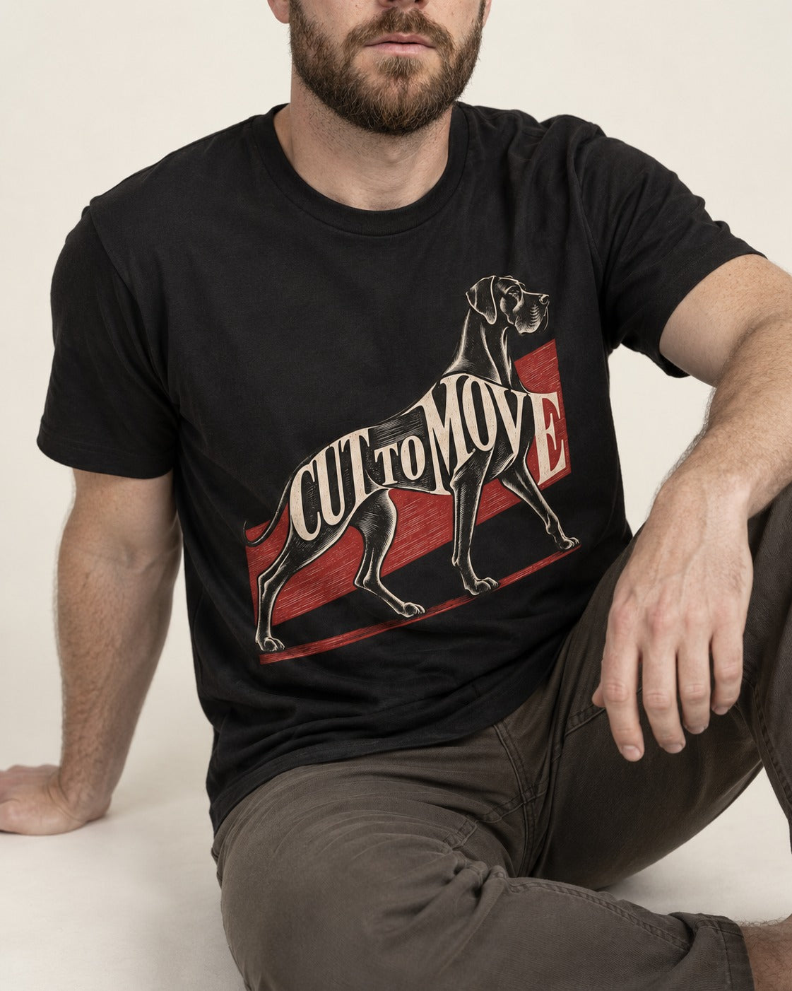 Great Dane Cut to Move Walking Typography Graphic T-Shirt in Black, worn by a seated model