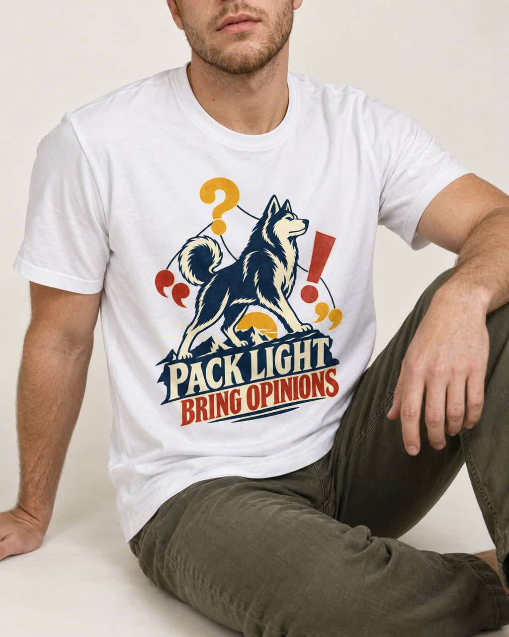 Husky Pack Light Bring Opinions T-Shirt in White, worn by a seated model
