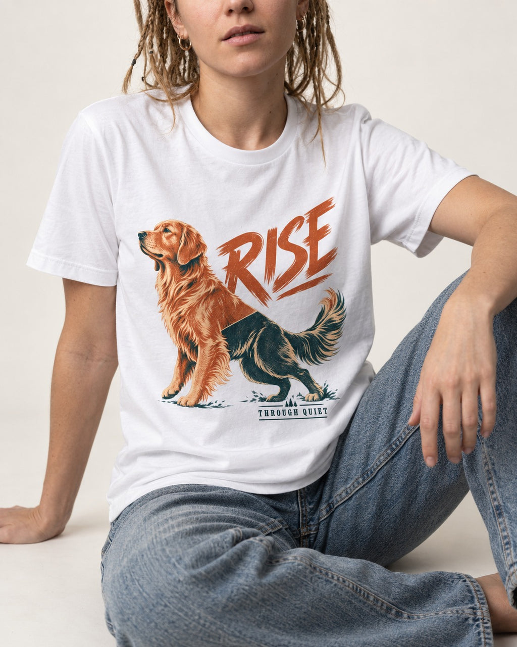 Golden Retriever Rise Through Quiet T-Shirt in White, worn by a seated model