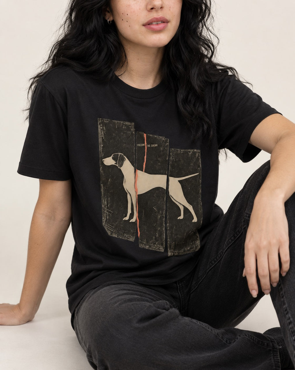 German Shorthaired Pointer Follow The Shear Split Panel Graphic T-Shirt in Black, worn by a seated model