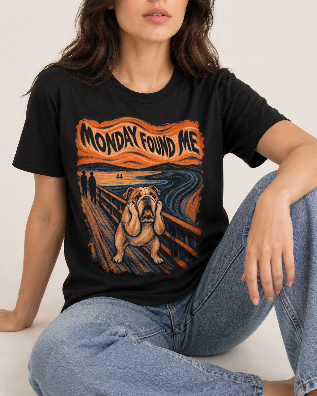 English Bulldog Monday Found Me Scream Graphic T-Shirt in Black, worn by a seated model