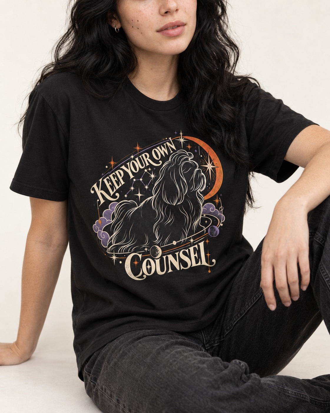 Shih Tzu Keep Your Own Counsel Celestial Graphic T-Shirt in Black, worn by a seated model
