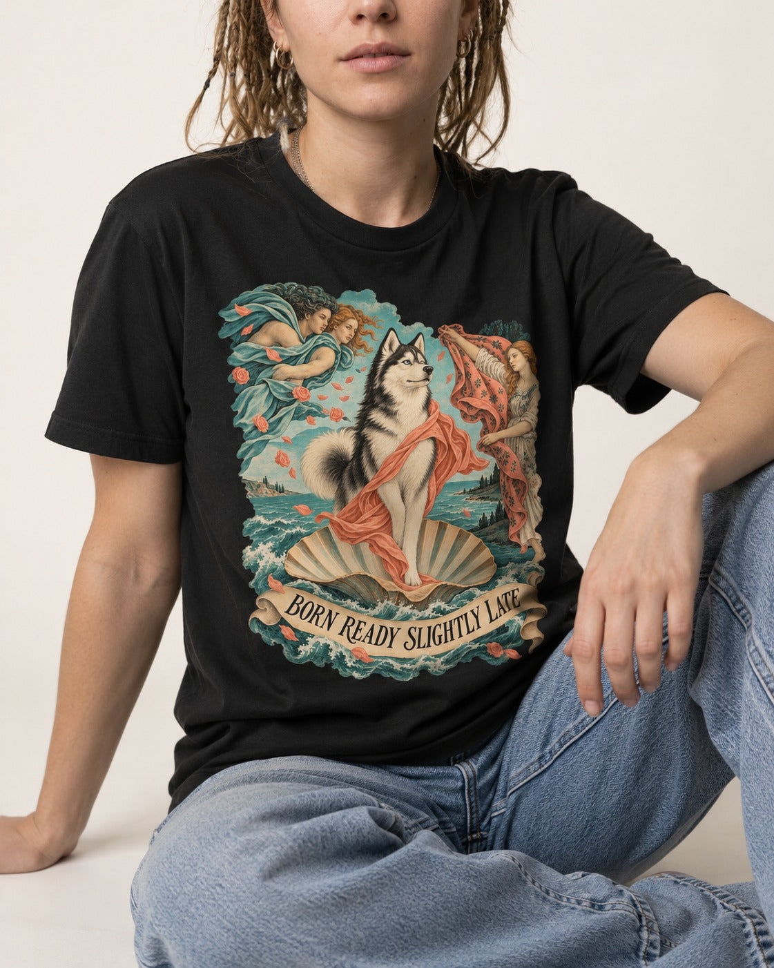 Husky Born Ready Slightly Late Renaissance Graphic T-Shirt in Black, worn by a seated model
