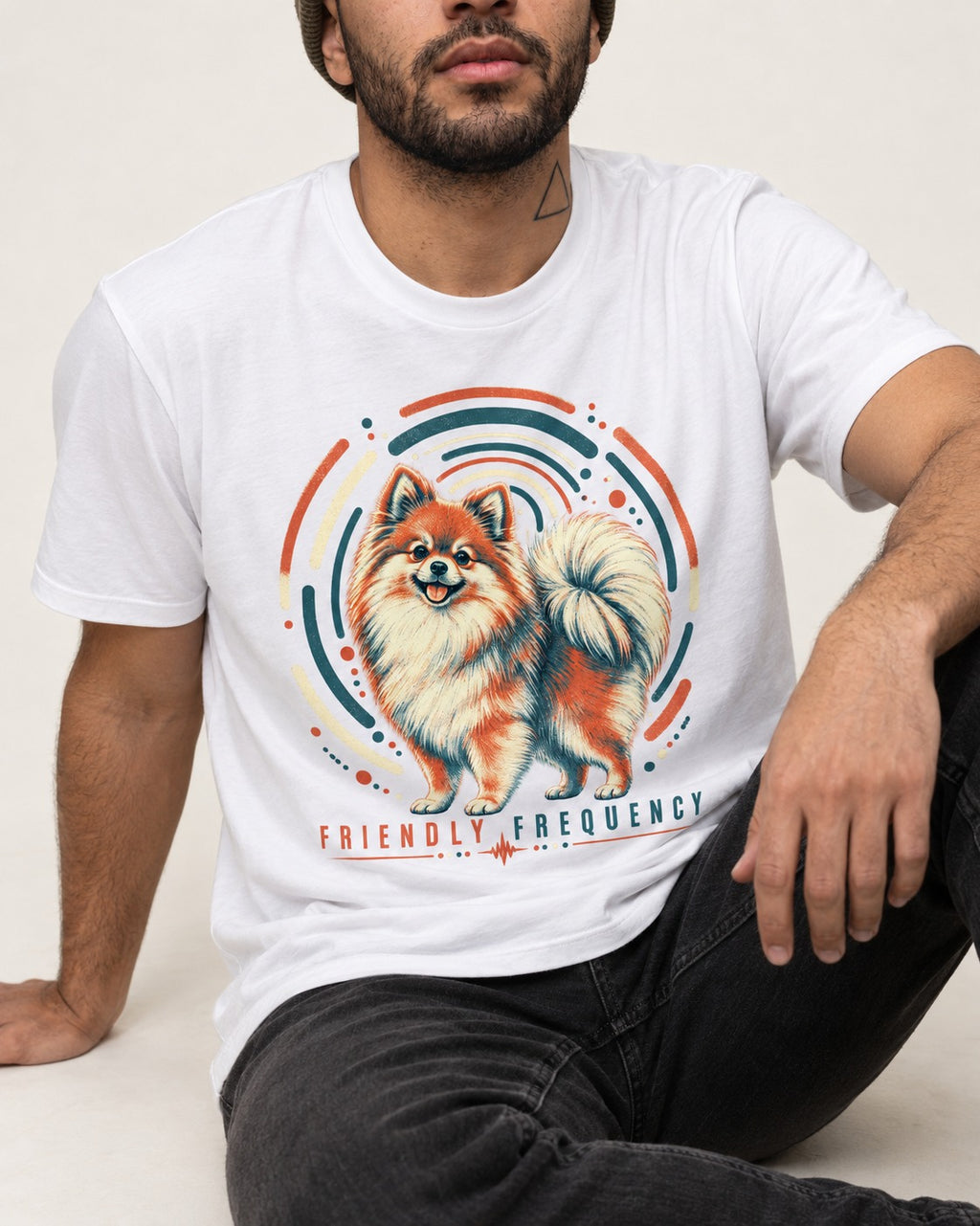 Friendly Frequency Pomeranian T-Shirt in White, worn by a seated model