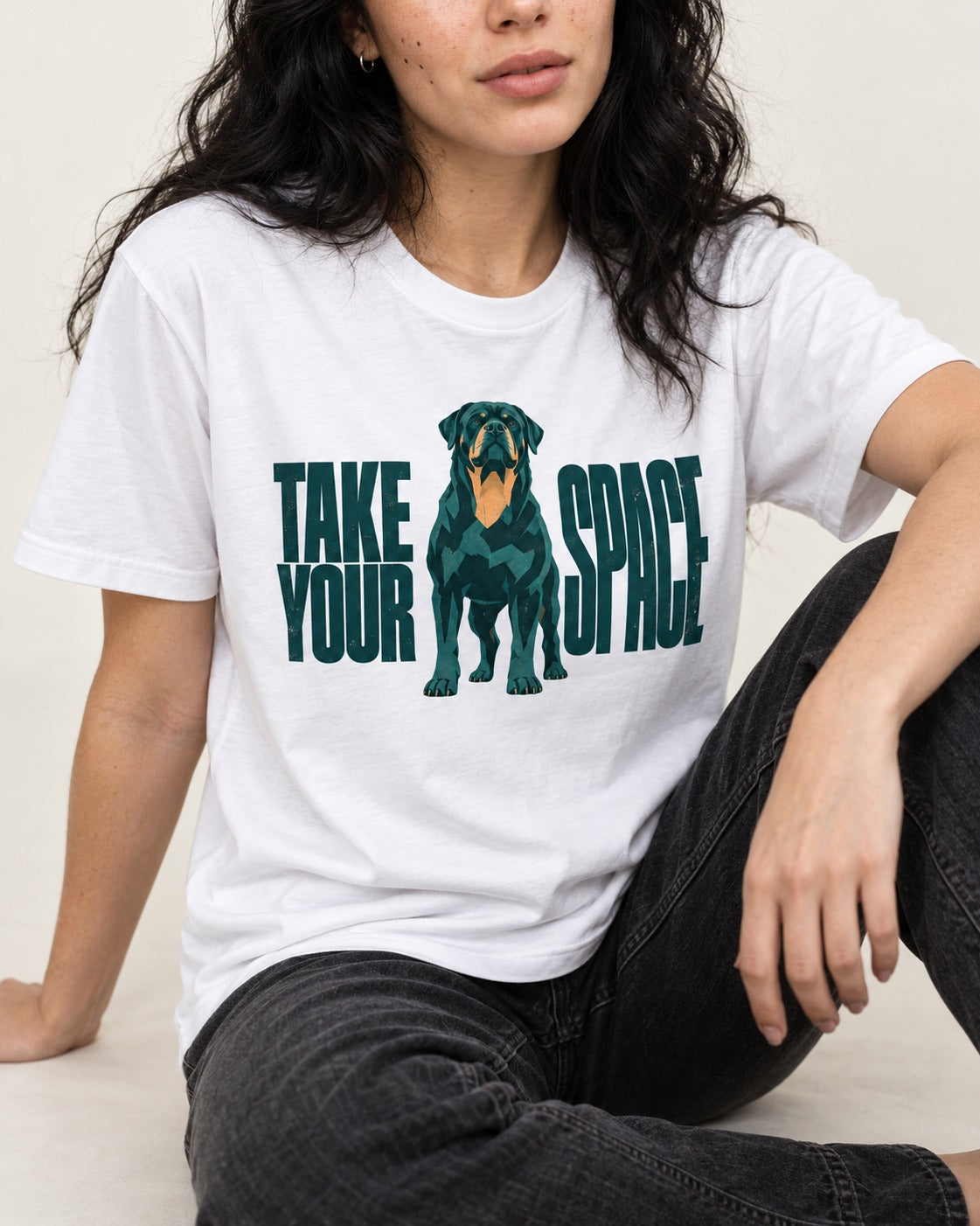 Rottweiler Take Your Space T-Shirt in White, worn by a seated model