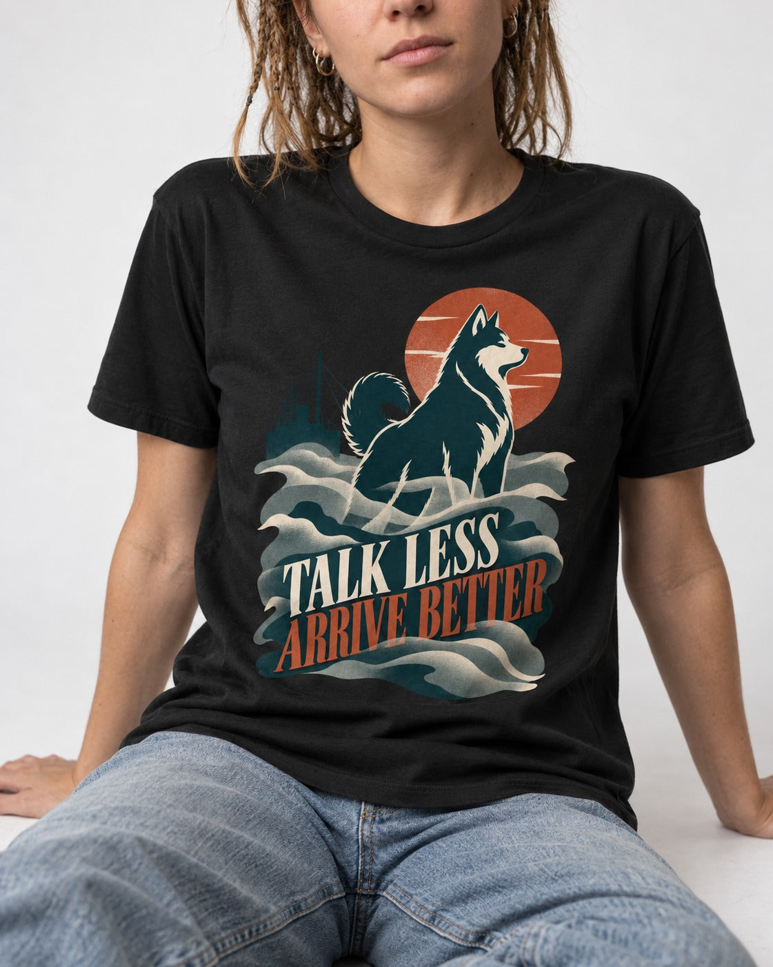 Husky Talk Less Arrive Better Harbor Wave Graphic T-Shirt in Black, worn by a seated model