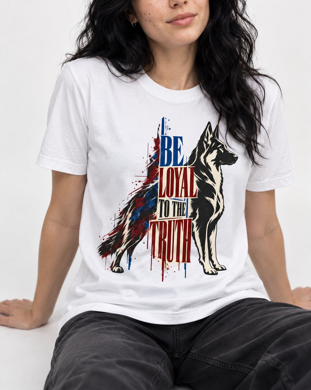 Loyal to the Truth German Shepherd Dog T-Shirt in White, worn by a seated model