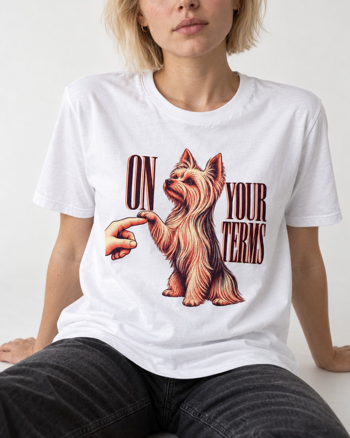 Yorkshire Terrier On Your Terms T-Shirt in White, worn by a seated model