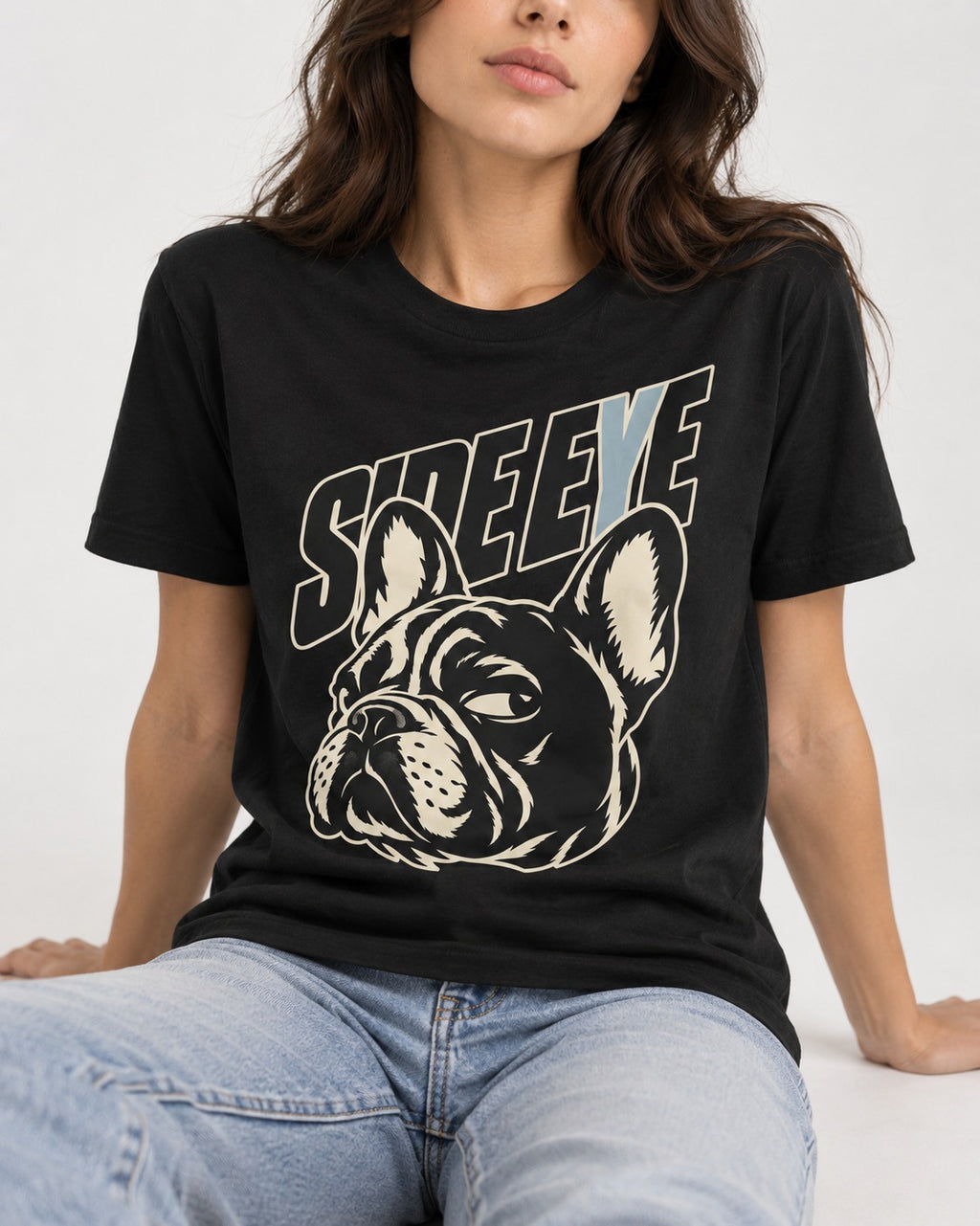 Frenchie Side Eye Portrait Graphic T-Shirt in Black, worn by a seated model