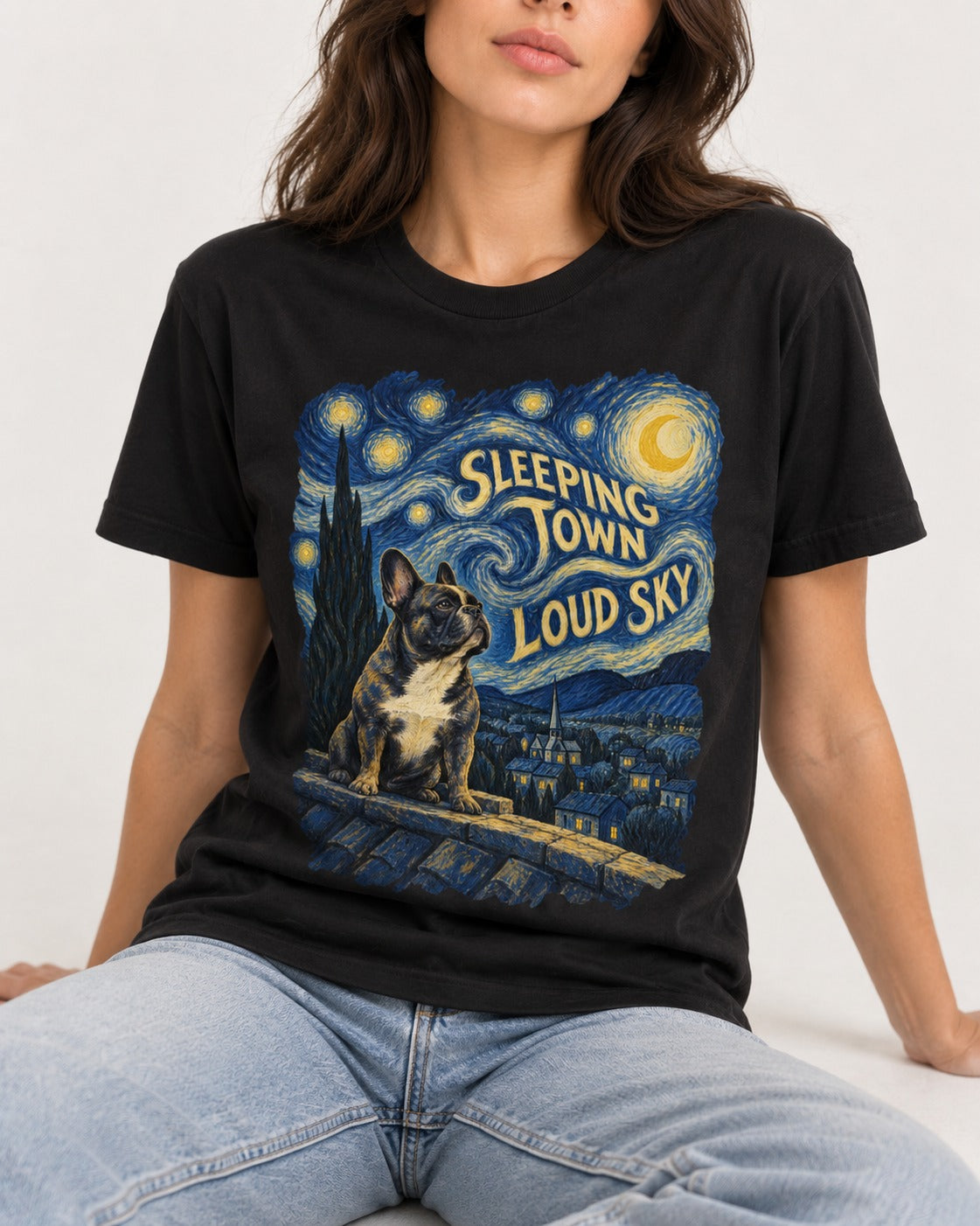 Frenchie Sleeping Town Loud Sky Rooftop Graphic T-Shirt in Black, worn by a seated model