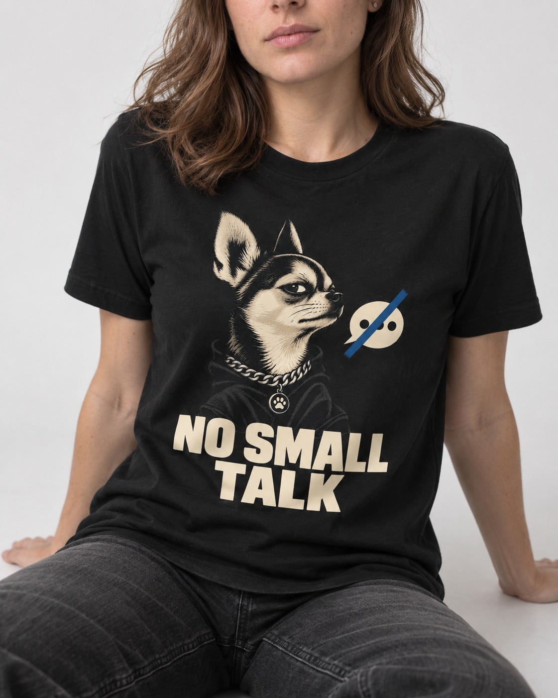 Chihuahua No Small Talk Speech-Off Portrait Graphic T-Shirt in Black, worn by a seated model