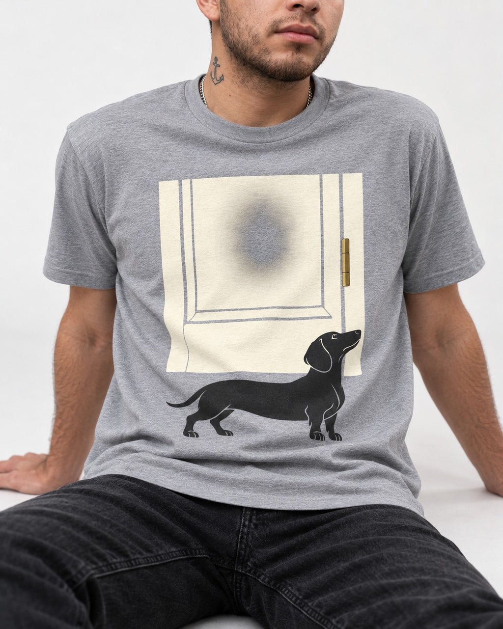 Dachshund Frosted Door Sentinel Graphic T-Shirt in Sport Grey, worn by a seated model