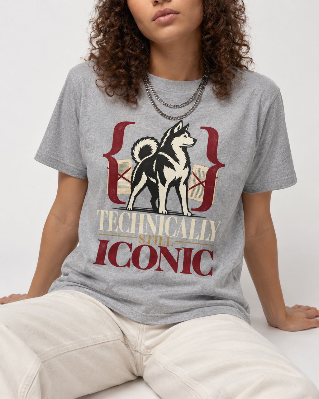 Husky Technically Still Iconic Editorial Frame Graphic T-Shirt in Sport Grey, worn by a seated model