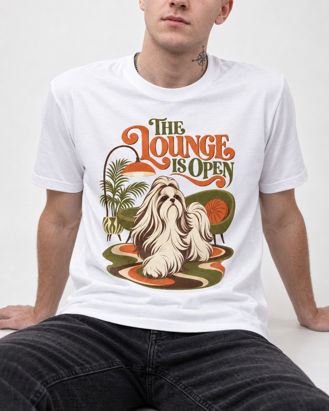 The Shih Tzu Lounge Is Open T-Shirt in White, worn by a seated model