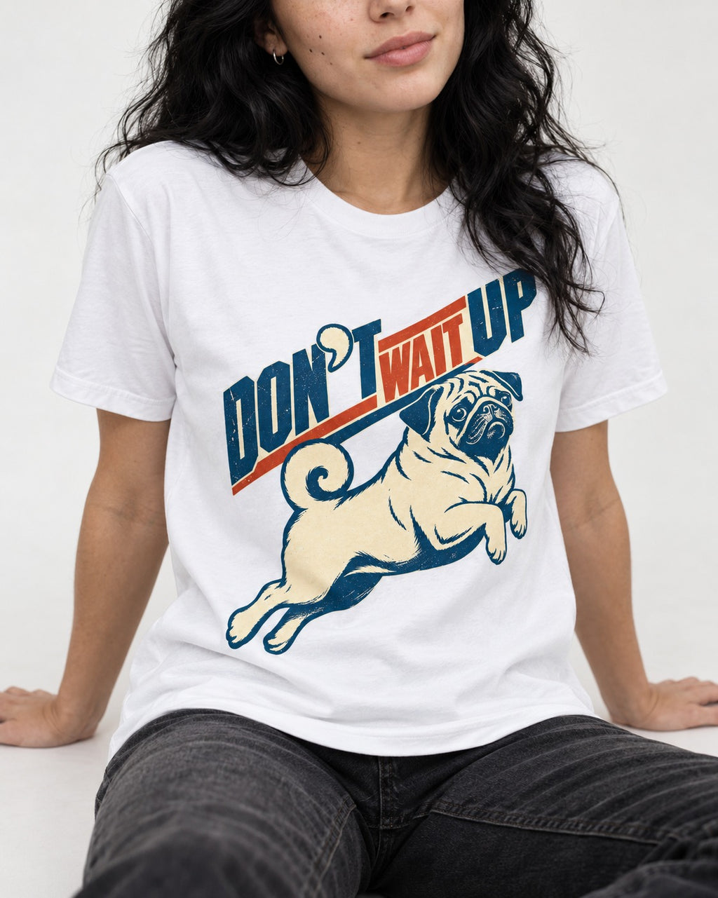 Don't Wait Up for Pug T-Shirt in White, worn by a seated model