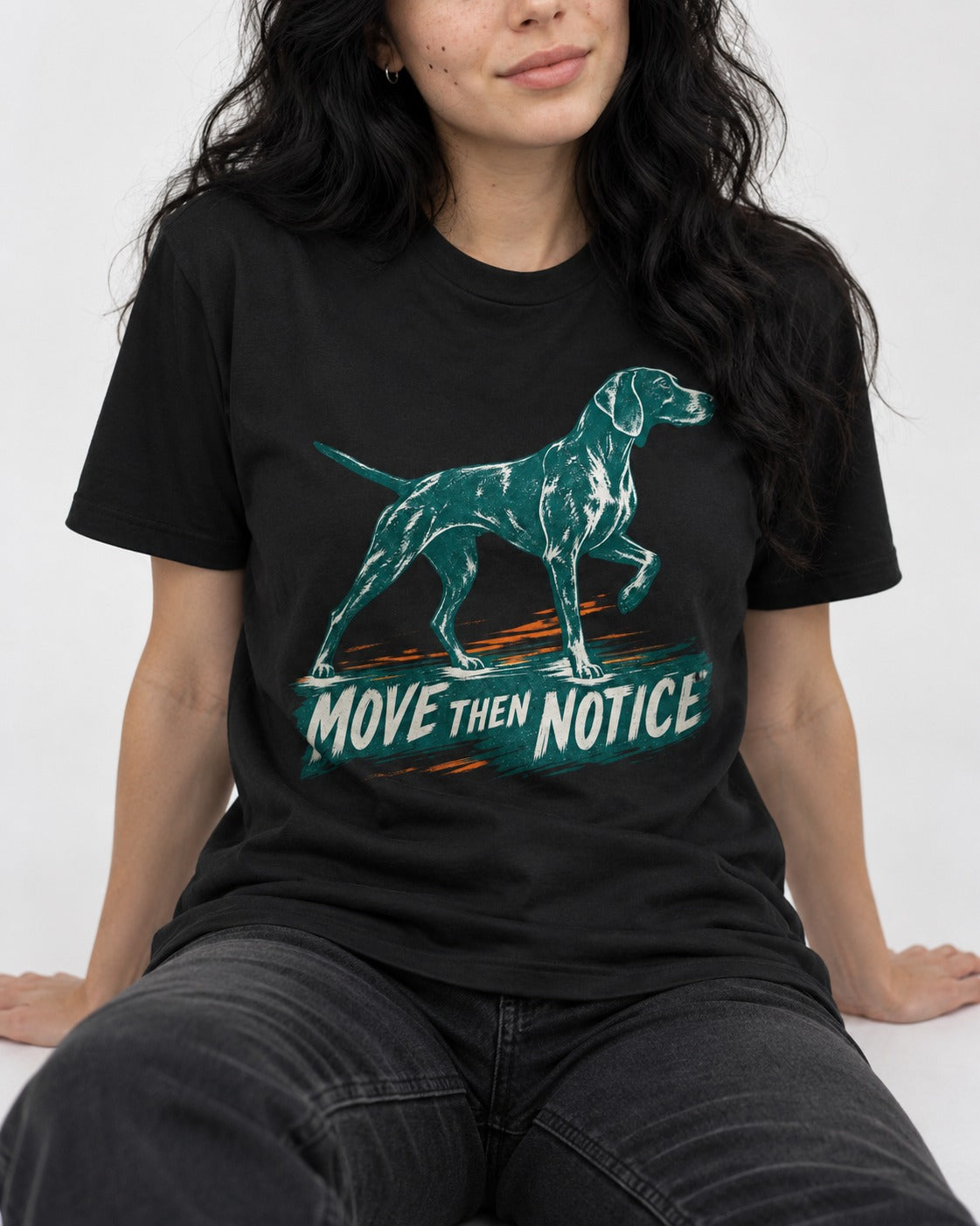 German Shorthaired Pointer Move Then Notice Brushstroke Graphic T-Shirt in Black, worn by a seated model