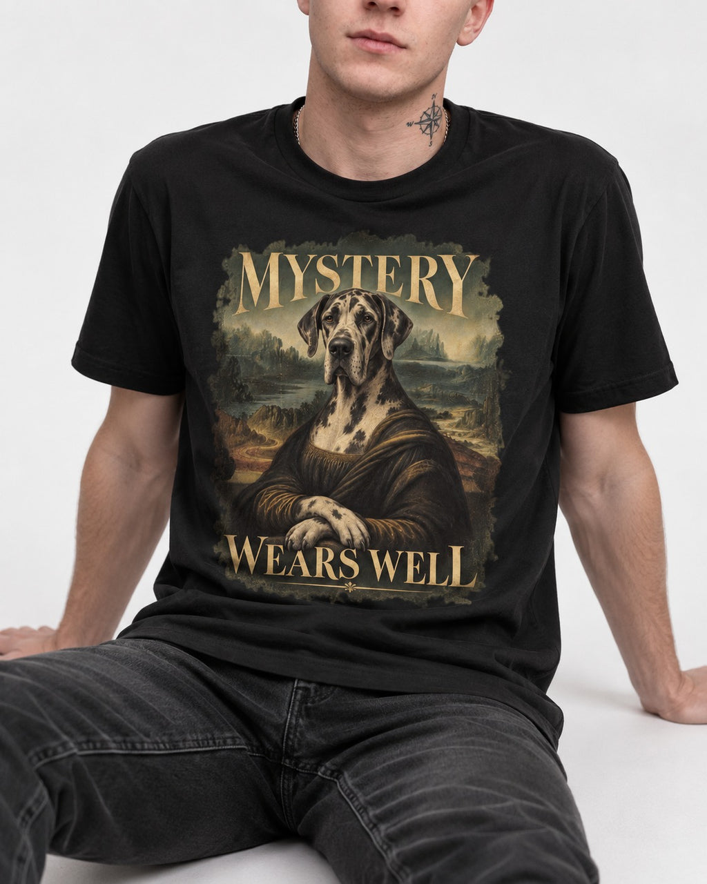 Great Dane Mystery Wears Well Renaissance Portrait Graphic T-Shirt in Black, worn by a seated model