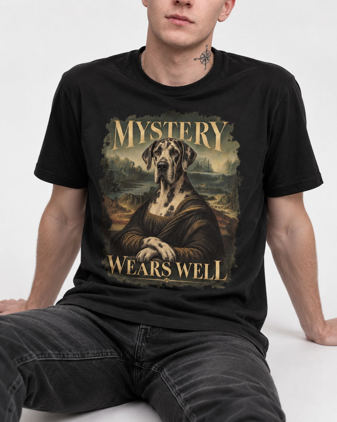 Great Dane Mystery Wears Well Renaissance Portrait Graphic T-Shirt in Black, worn by a seated model