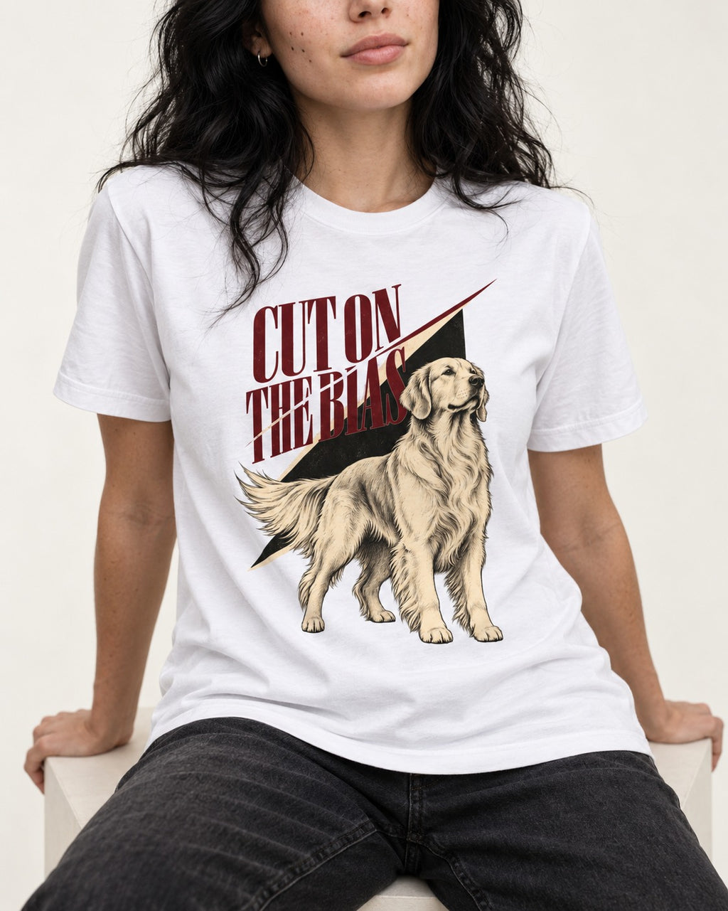 Cut on the Bias Golden Retriever T-Shirt in White, worn by a seated model
