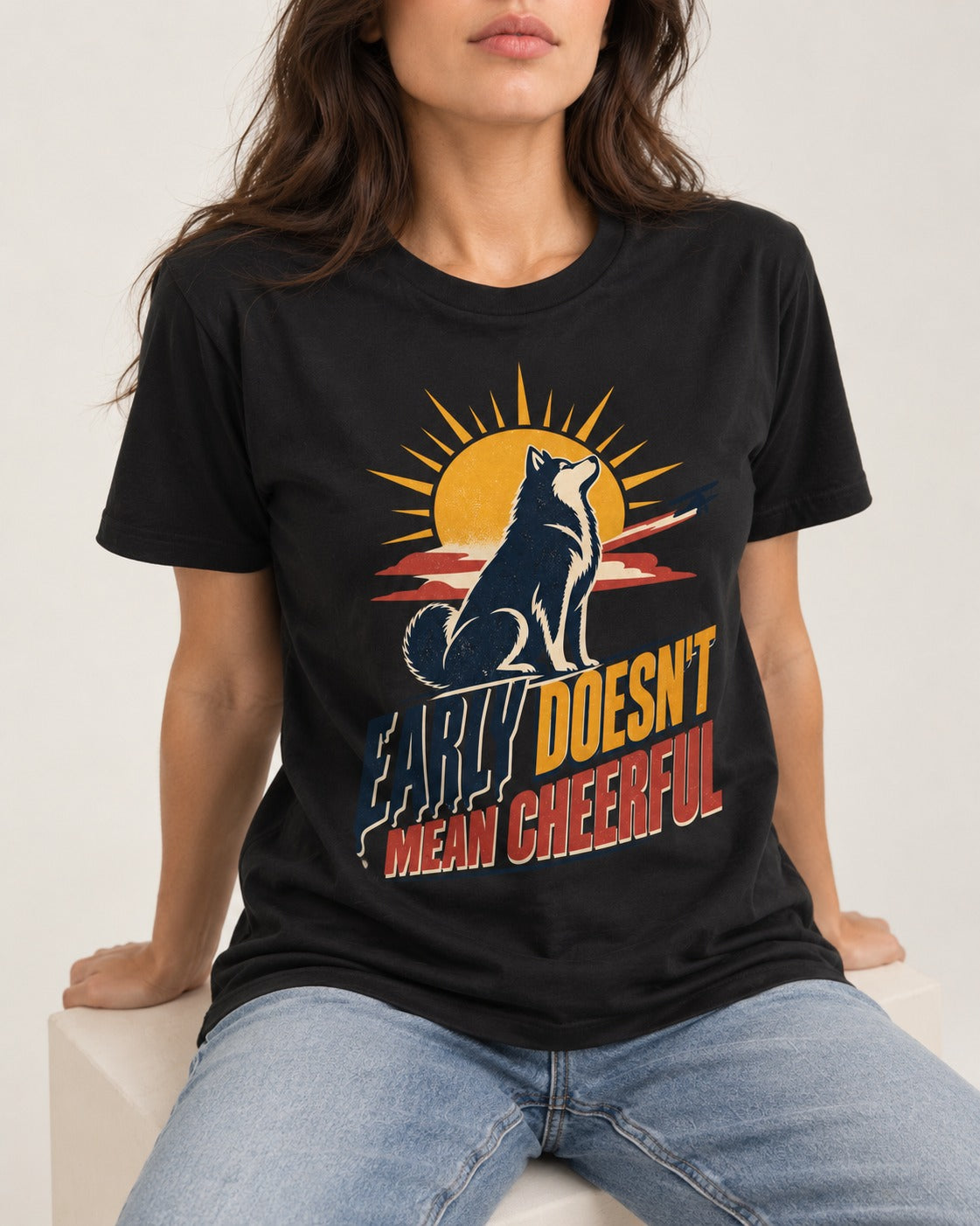 Husky Early Doesnt Mean Cheerful Sunrise Airplane Graphic T-Shirt in Black, worn by a seated model