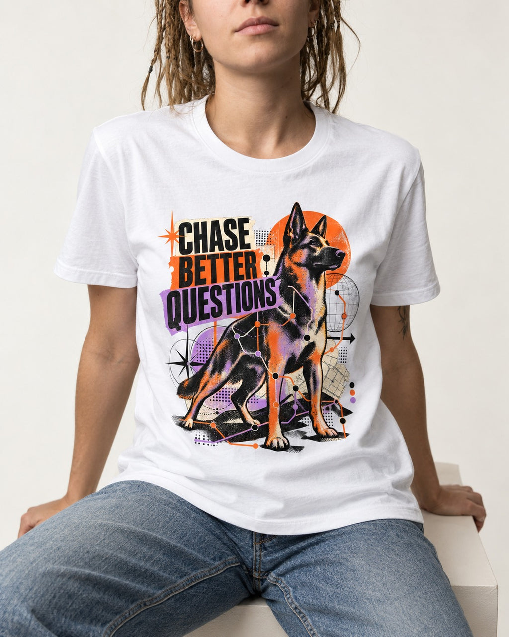 Chase Better Questions German Shepherd Dog T-Shirt in White, worn by a seated model