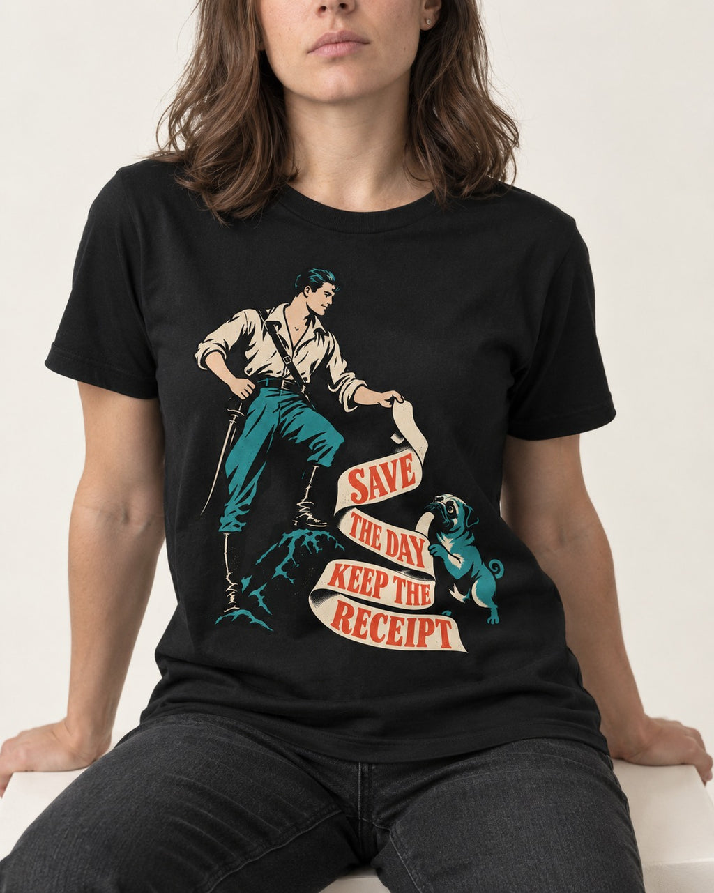 Pug Save the Day Keep the Receipt Hero Graphic T-Shirt in Black, worn by a seated model