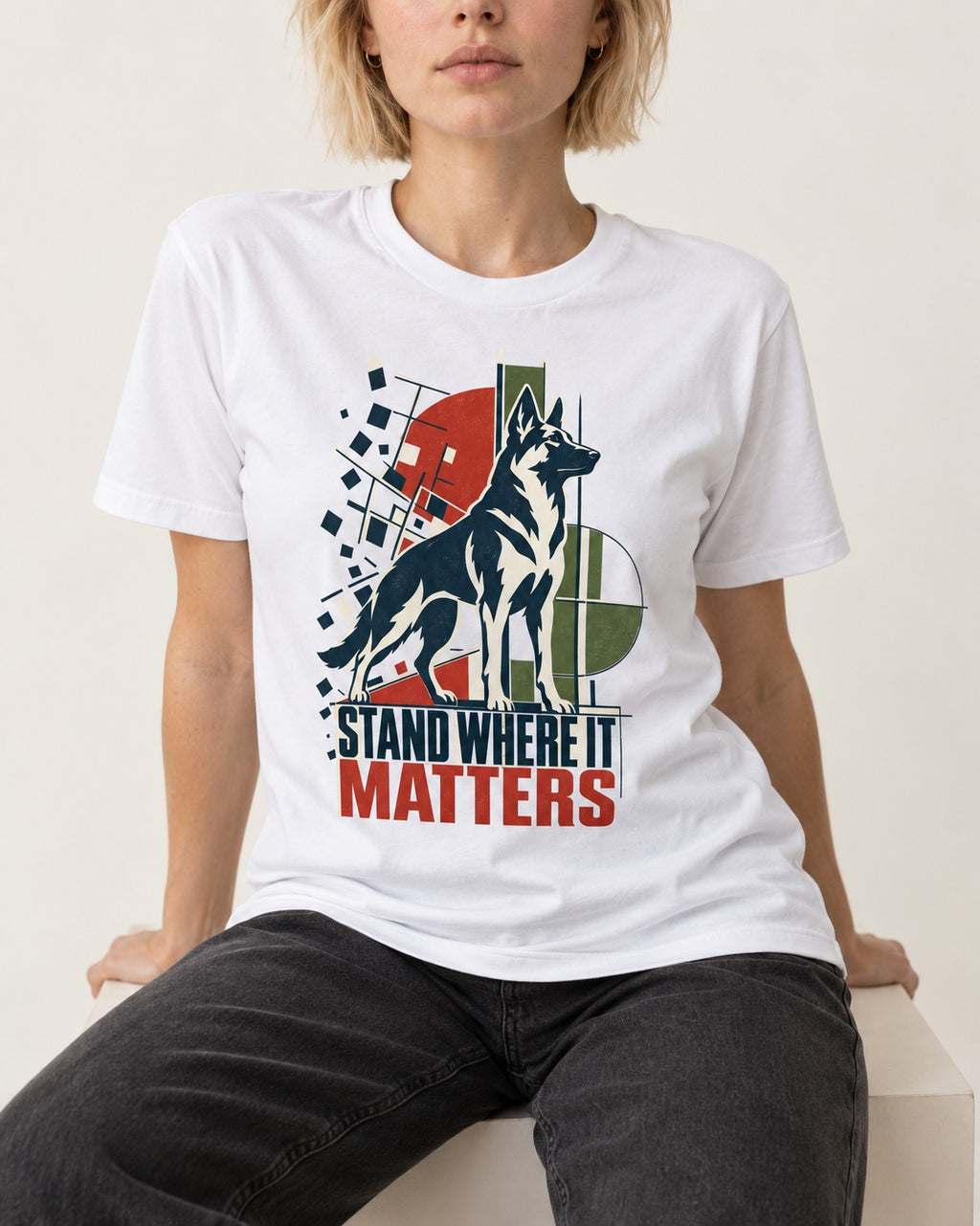Stand Where It Matters German Shepherd Dog T-Shirt in White, worn by a seated model