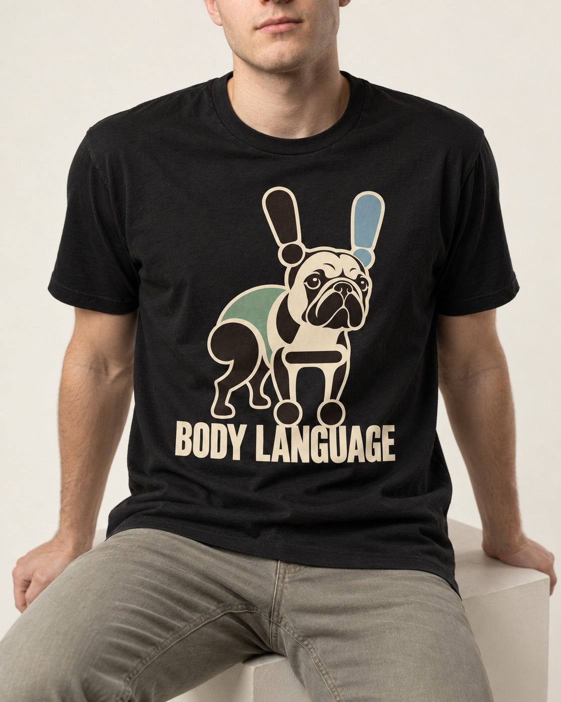 Frenchie Body Language Punctuation Graphic T-Shirt in Black, worn by a seated model
