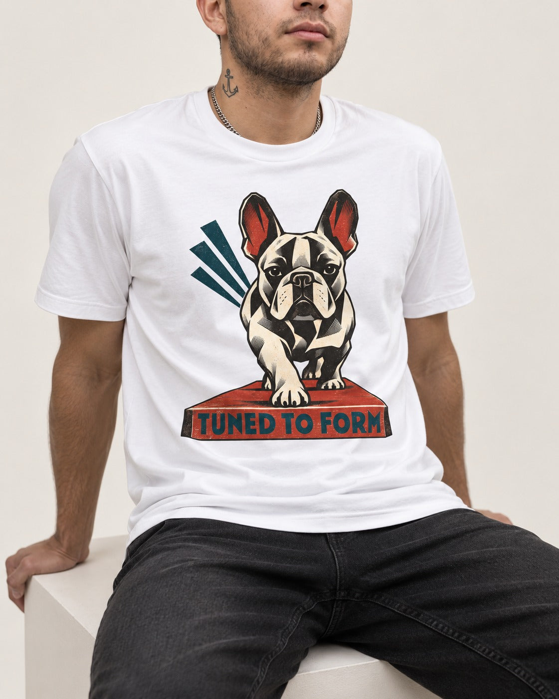 Frenchie Tuned to Form T-Shirt in White, worn by a seated model